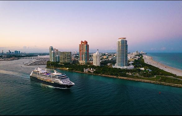 Azamara Quest cruise ship passing Miami buildings
